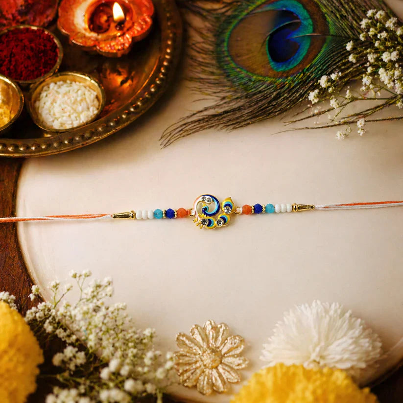 Traditional designer Rakhi with peacock motif, perfect for Raksha Bandhan