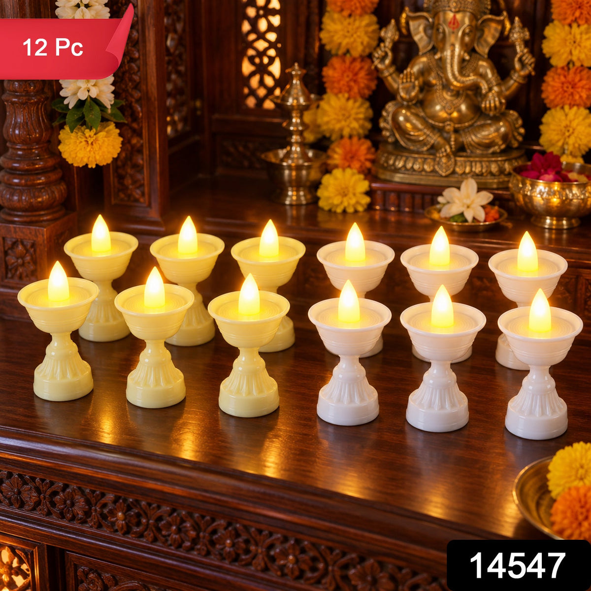 Twelve LED diya candles, six yellow and six white, illuminate a wooden altar with a golden Ganesha statue and marigold