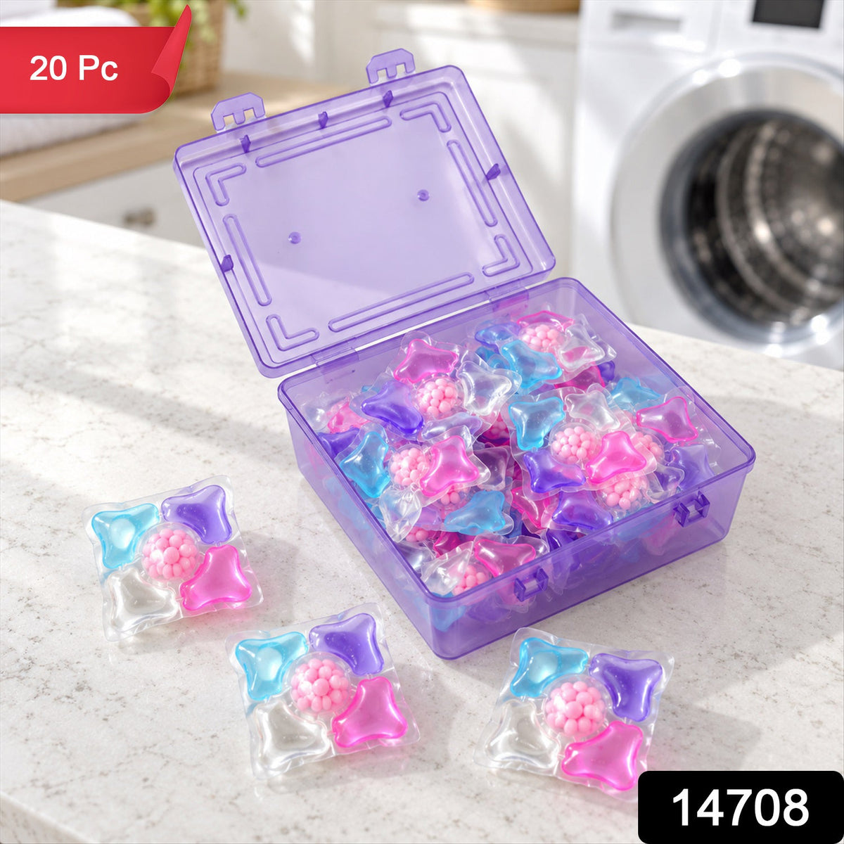 An open purple plastic box holds many bright laundry pods, with three individual pods on a white countertop. A washing