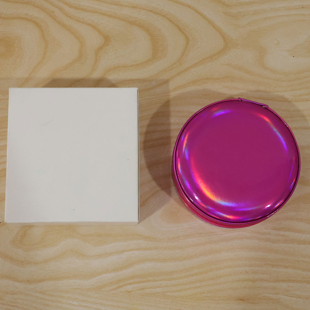 Holographic pink jewellery organiser packed in a travel bag