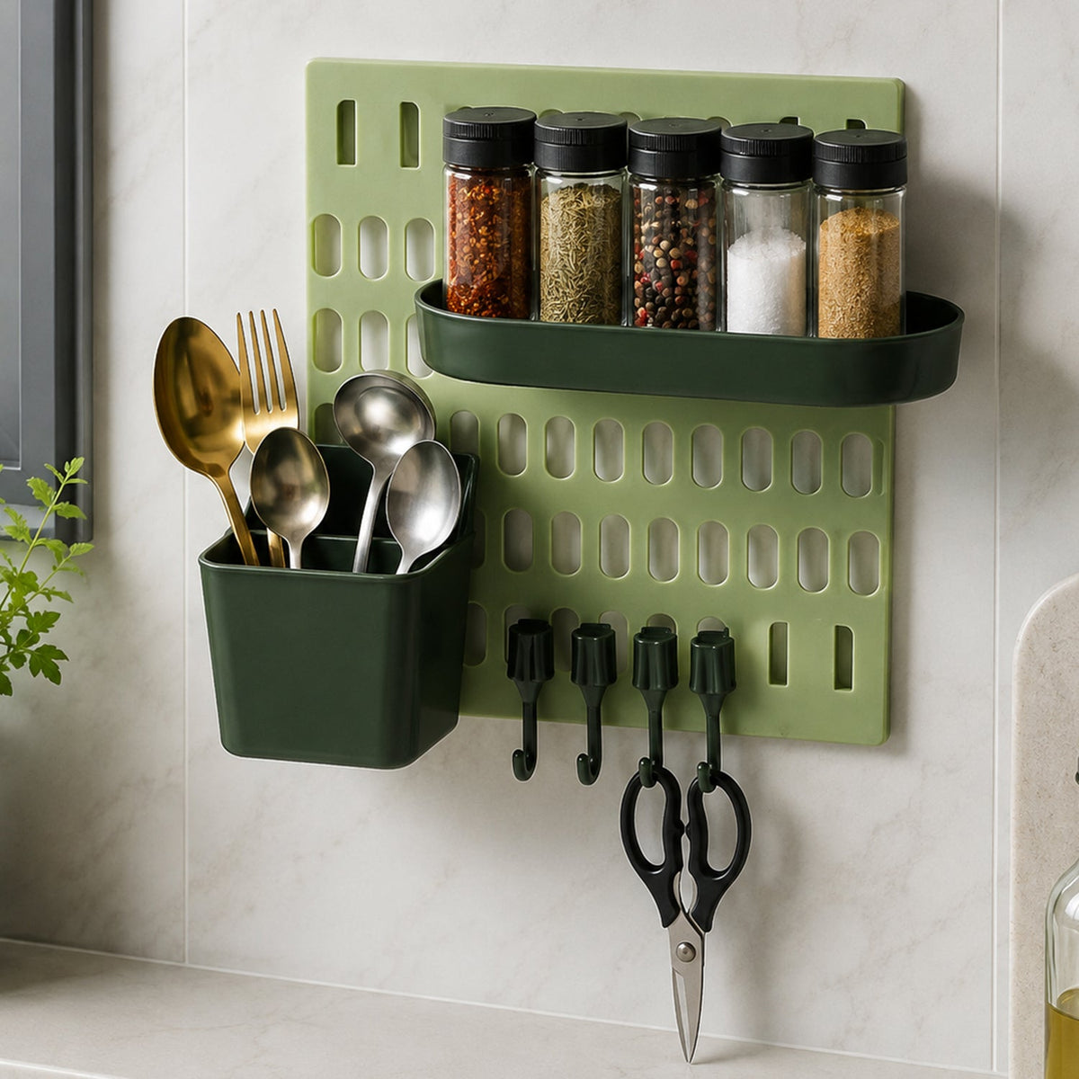 A light green pegboard with a dark green spice rack holding five spice jars, a dark green utensil holder with gold â€“ view 8