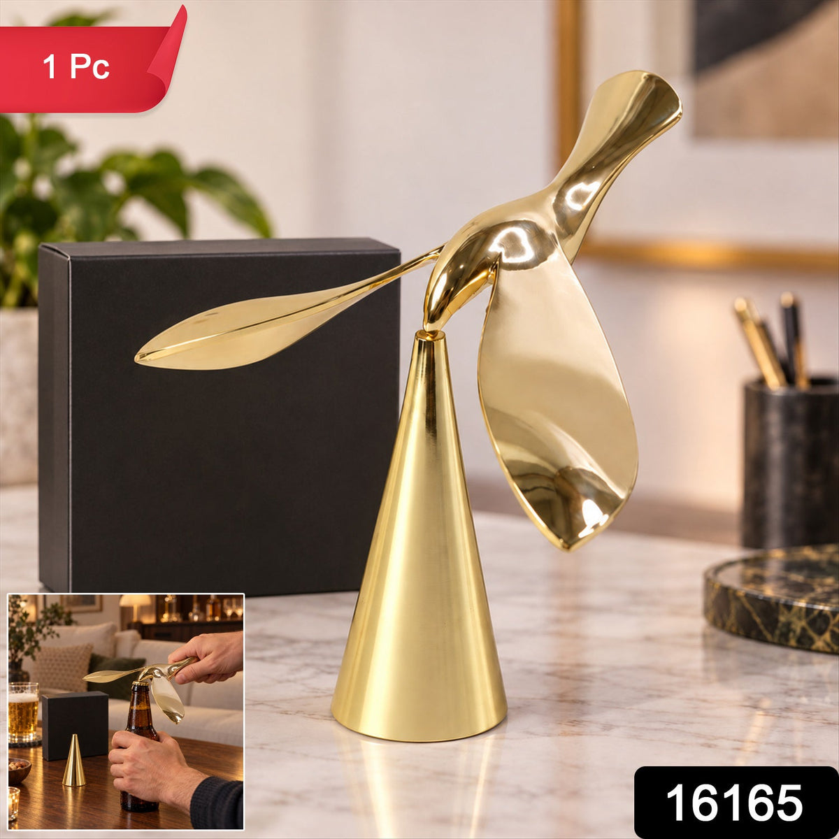 A gold balancing bird sculpture and black box are on a marble desk; a small inset shows hands opening a bottle.