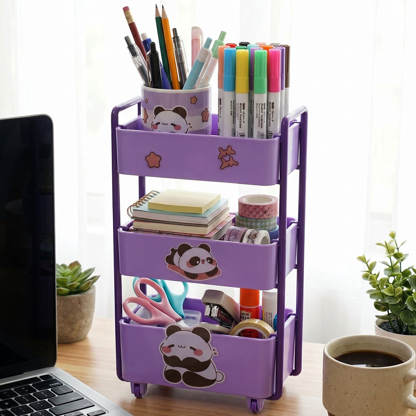 A child's desk featuring the rolling mini storage trolley for art and craft supplies.