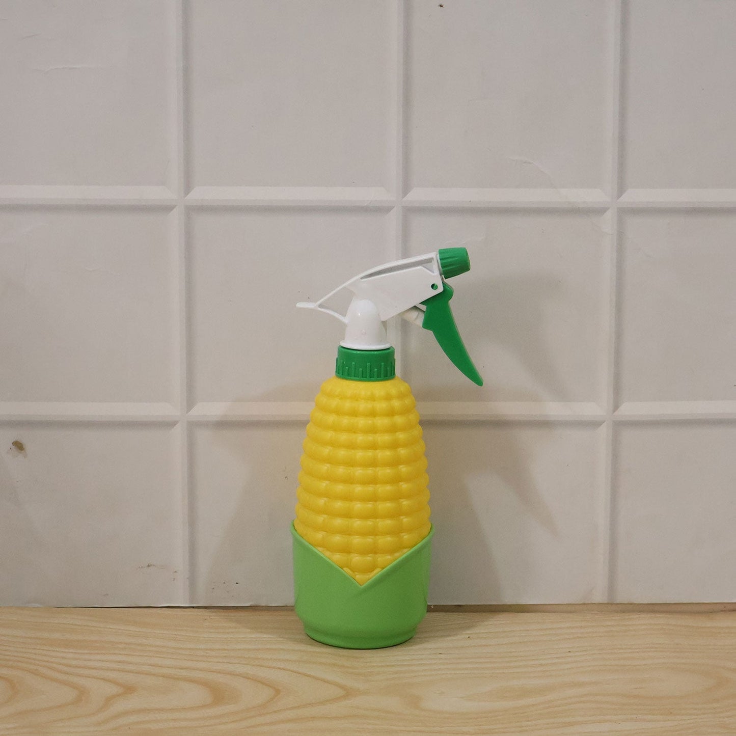 Close-up of the unique corn shape design of the sprayer bottle.