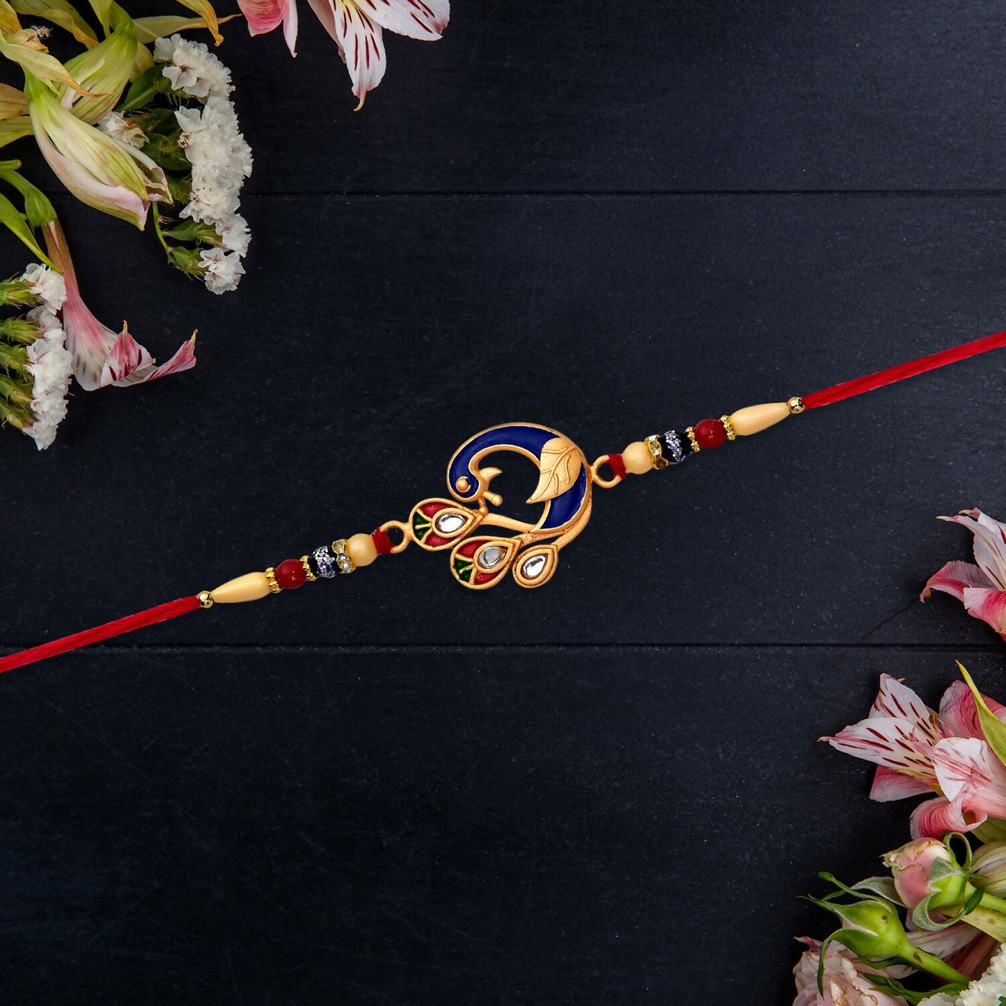 Comfortable, skin-friendly beaded thread of the Peacock Meenakari Rakhi.