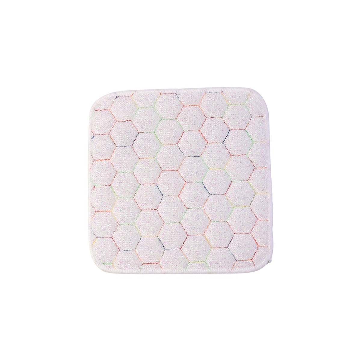 Close-up, top-down view of a white square cleaning cloth with a multicolored honeycomb pattern on a white background.