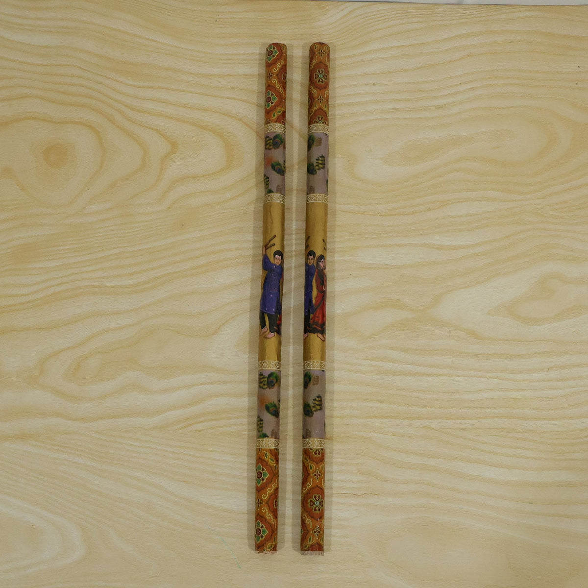 Live photo of wooden base Dandiya stick pair