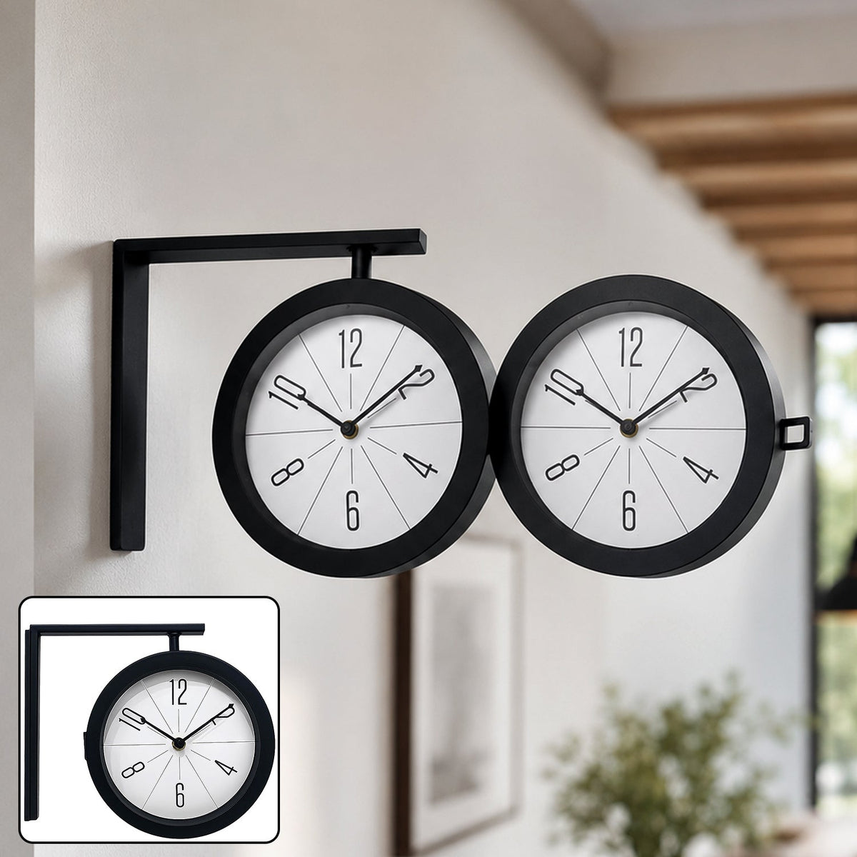 A black metal double-sided clock with a white face and minimalist numbers, mounted on a white wall.