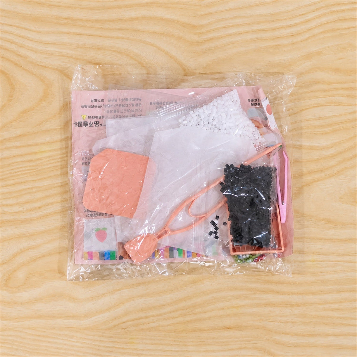 Live photo of kids plastic beads craft kit in plastic packing