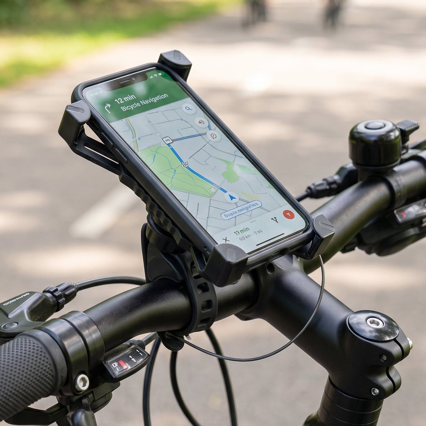 Bicycle phone holder mounted on a handlebar