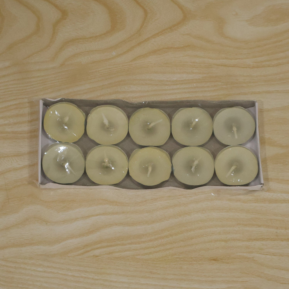 Decorative wax tea light candles used in a festive home setting