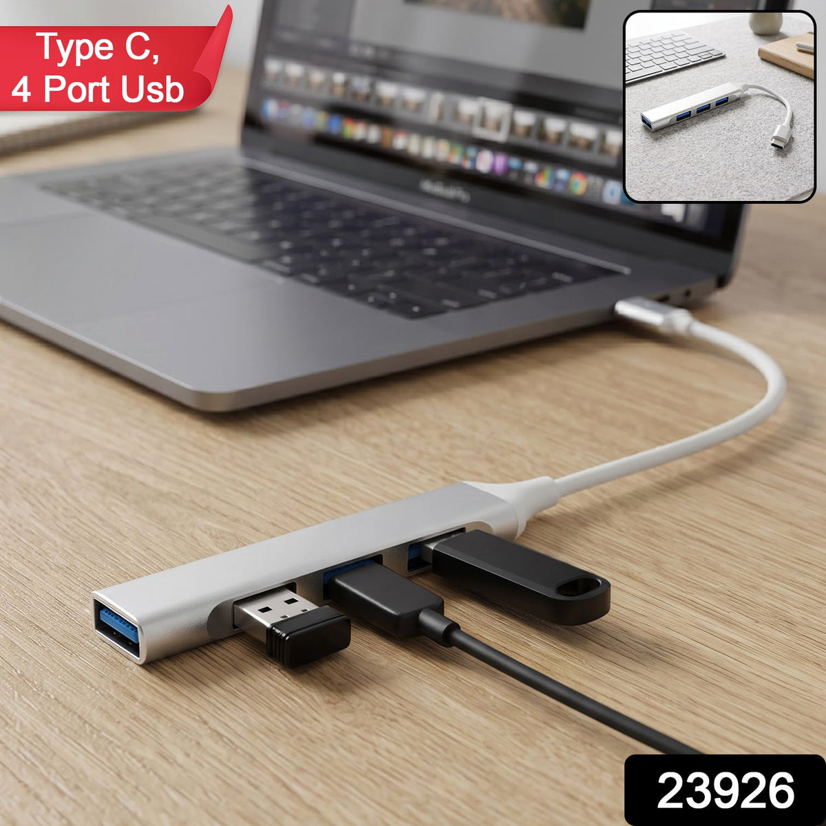 A silver Type C to four-port USB hub connected to a laptop, with a USB drive and cable plugged in.
