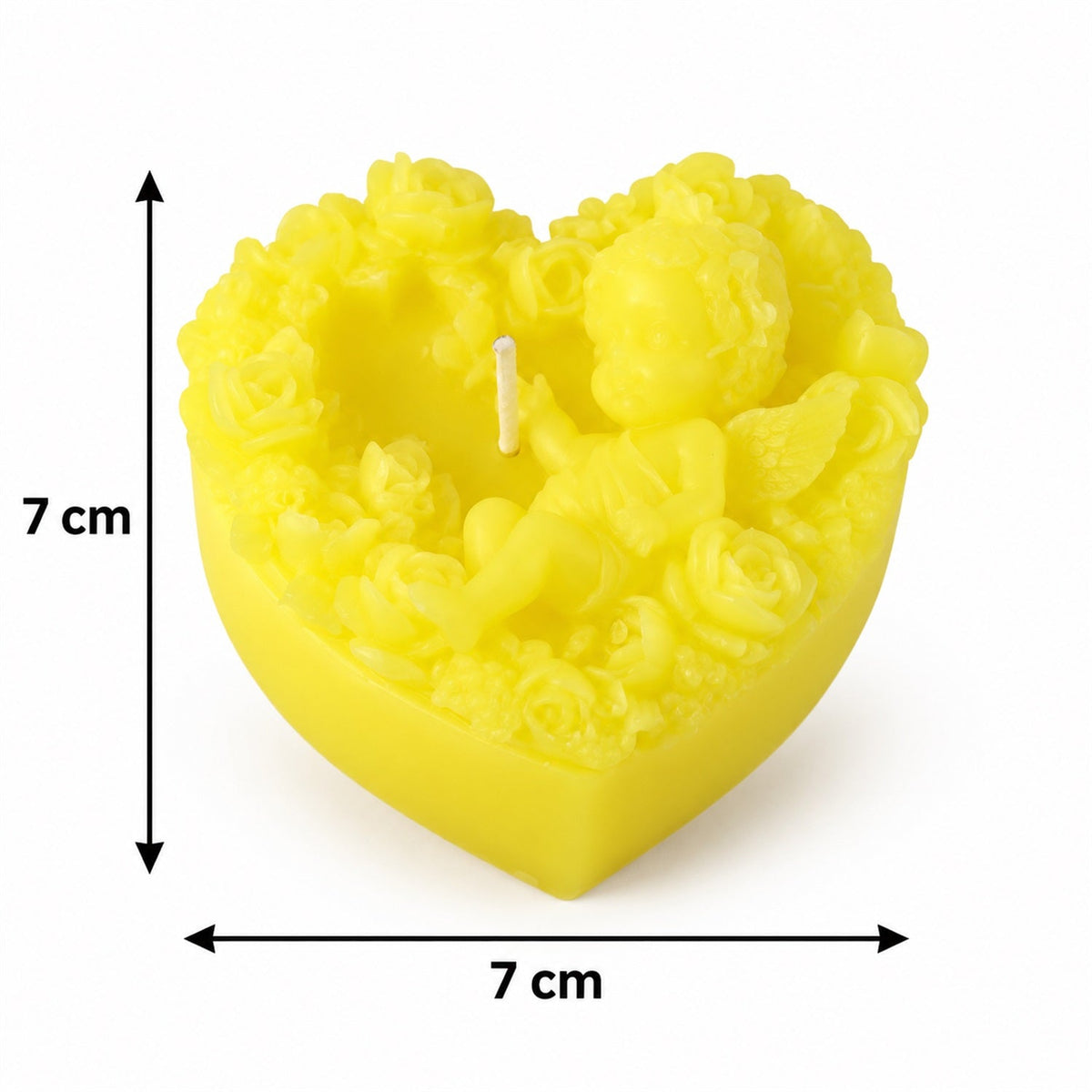 A yellow heart-shaped candle with cherub and floral designs, showing dimensions of 7 cm in width and height.