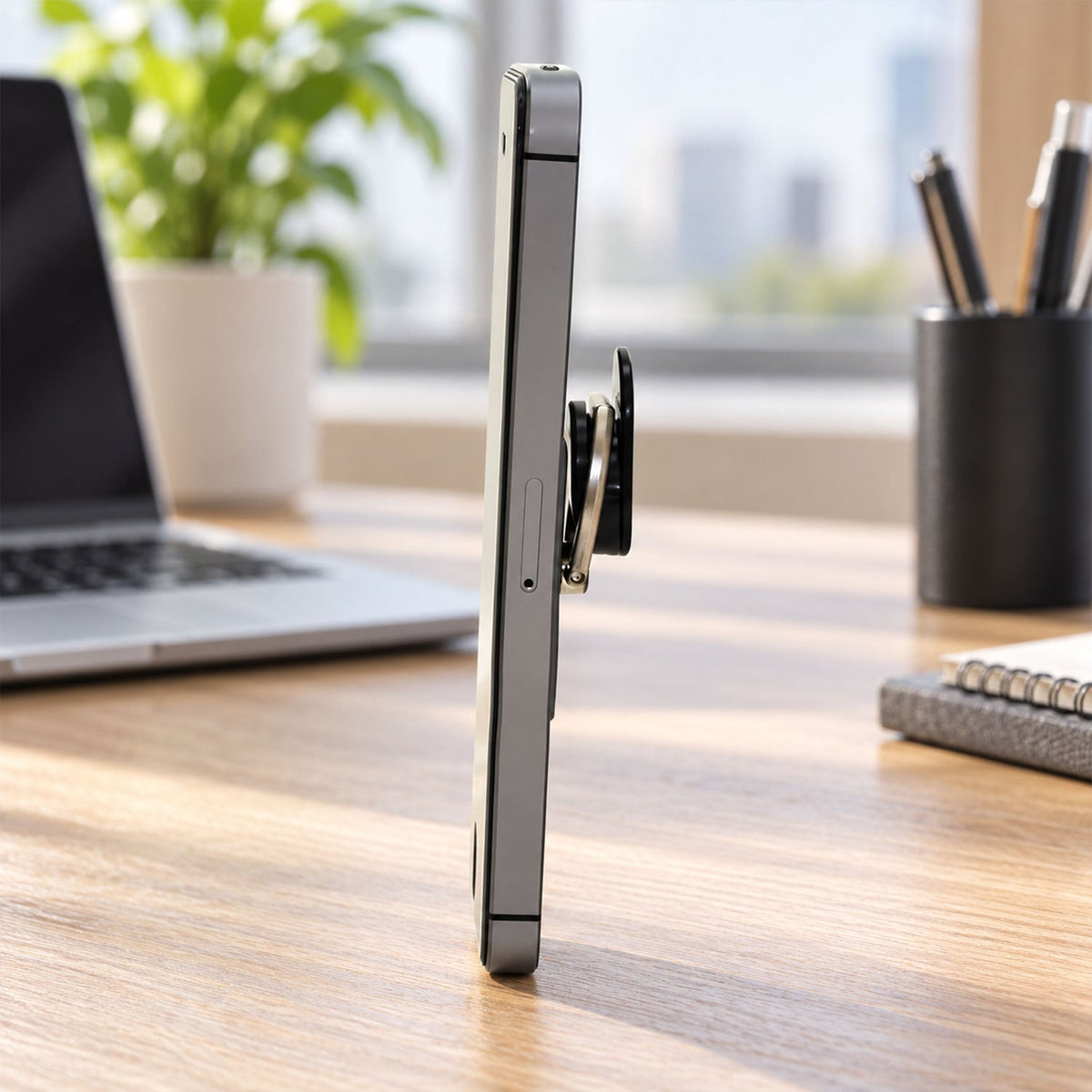 The gray phone ring holder is shown with callouts highlighting its smooth pivot, fold-flat profile, comfort-fit ring, and