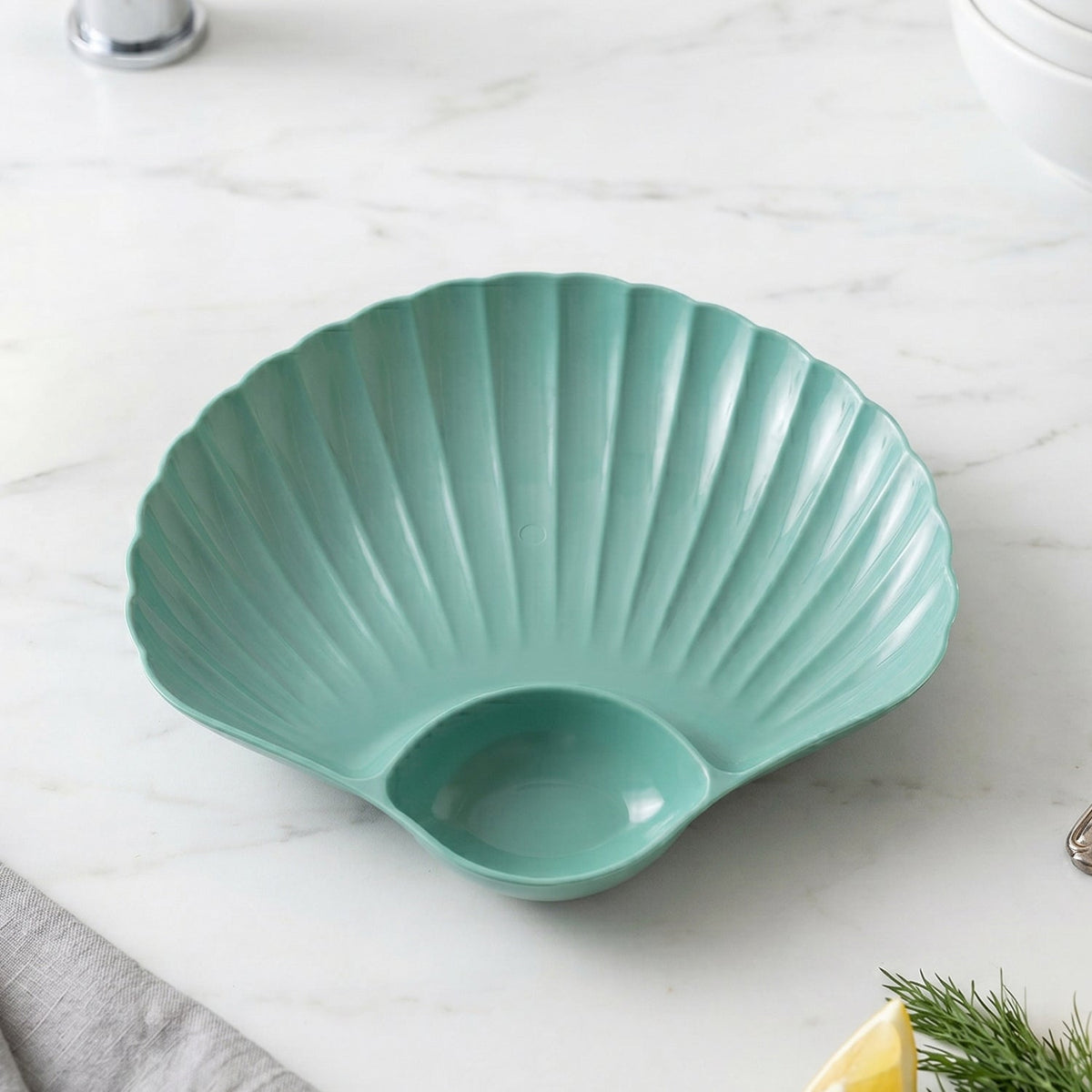 Stacked shell-shaped snack serving plates in assorted bright colors for easy storage.