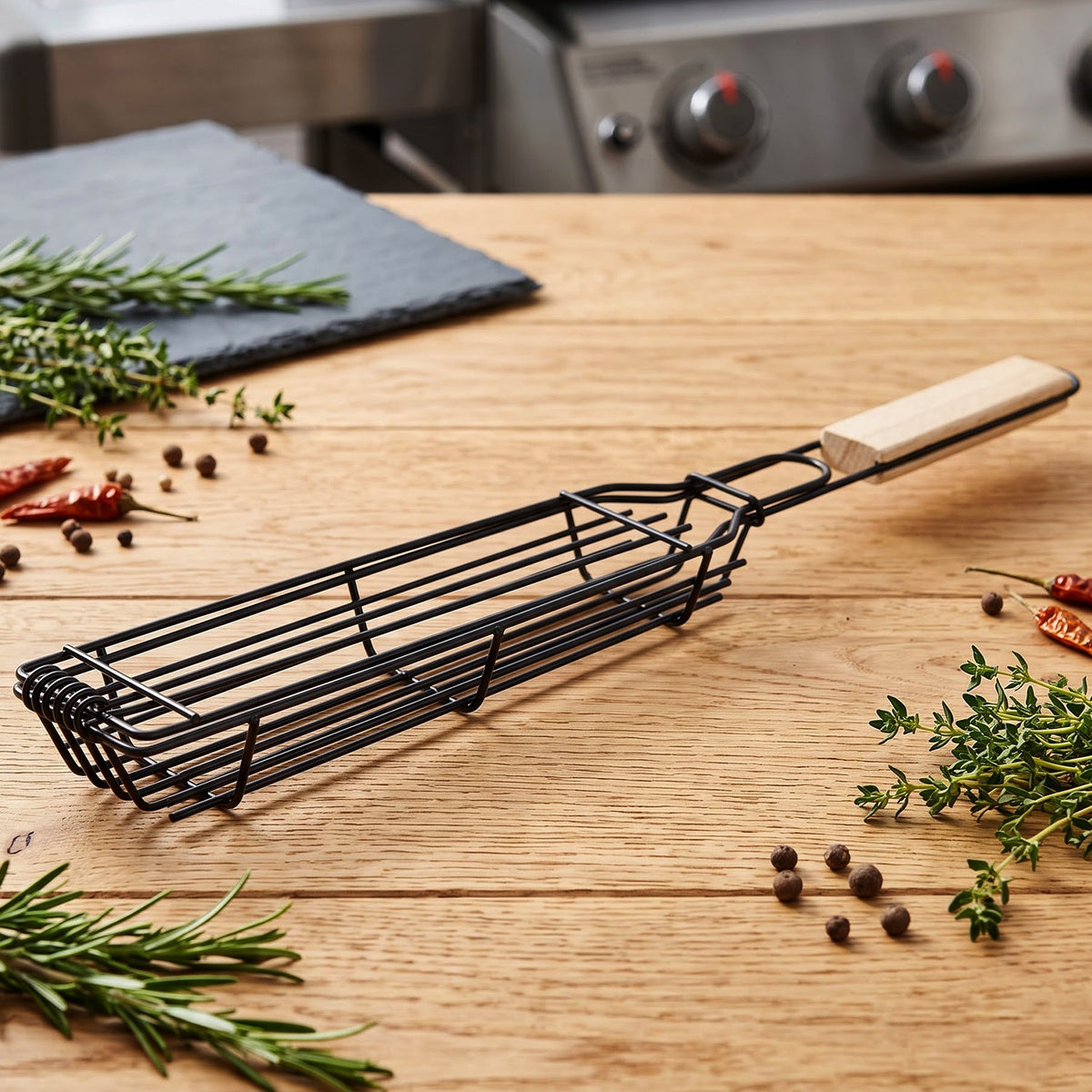 Metal grilling basket with wooden grip handle