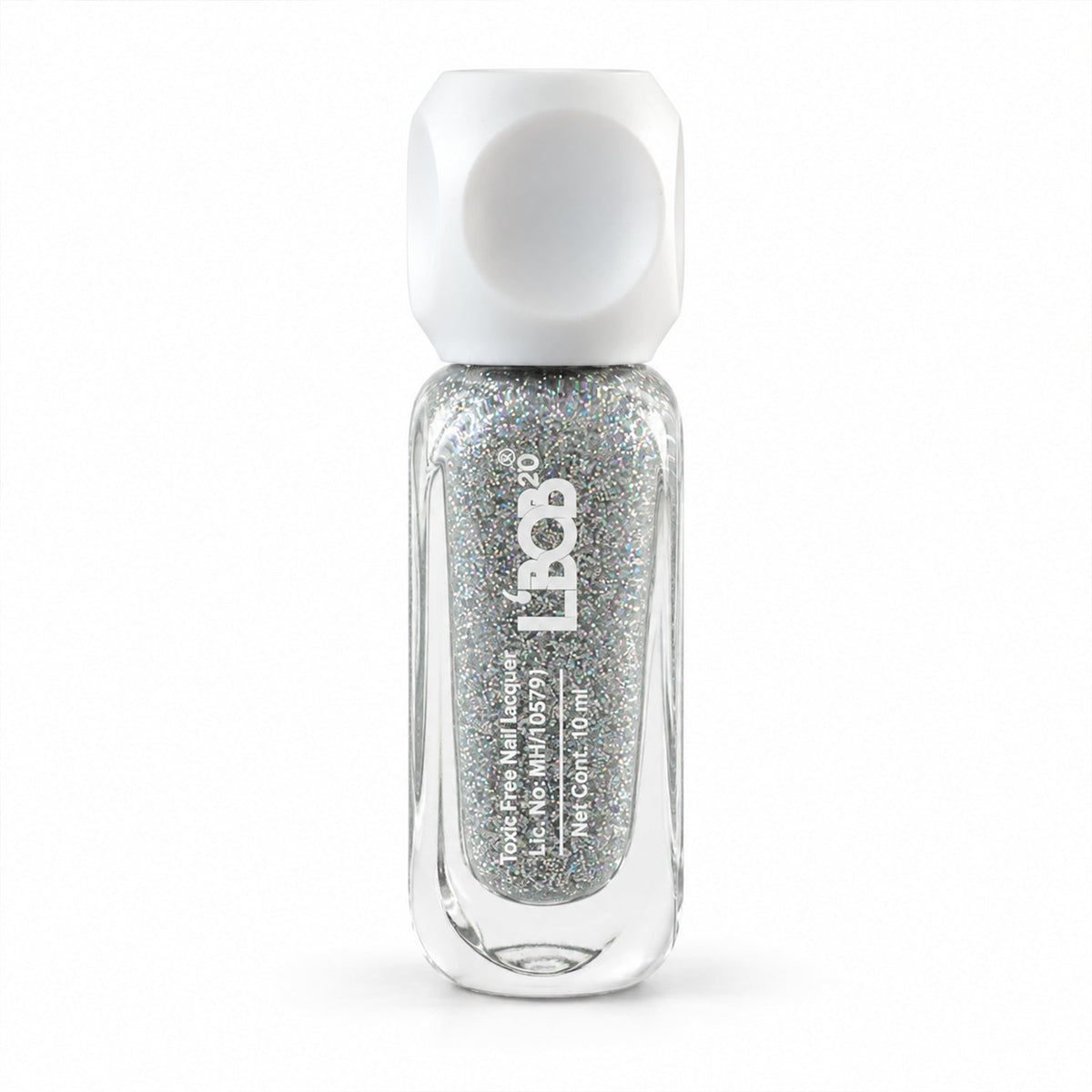 A clear bottle of silver glitter nail polish with a white, geometric cap stands upright on a white background.