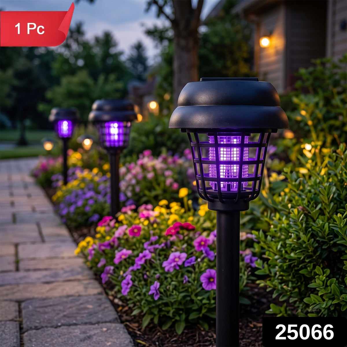 Three black solar mosquito lamps with purple light line a garden path with blooming flowers and a house in the background.
