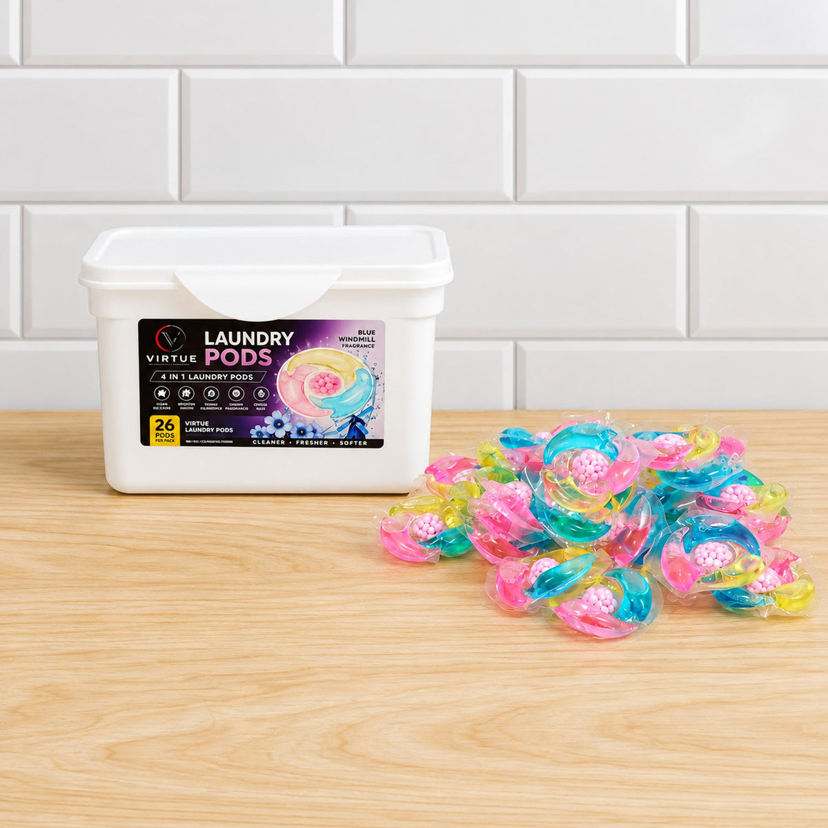 A white container of laundry pods and a heap of individual colorful pods are displayed on a light wooden surface.