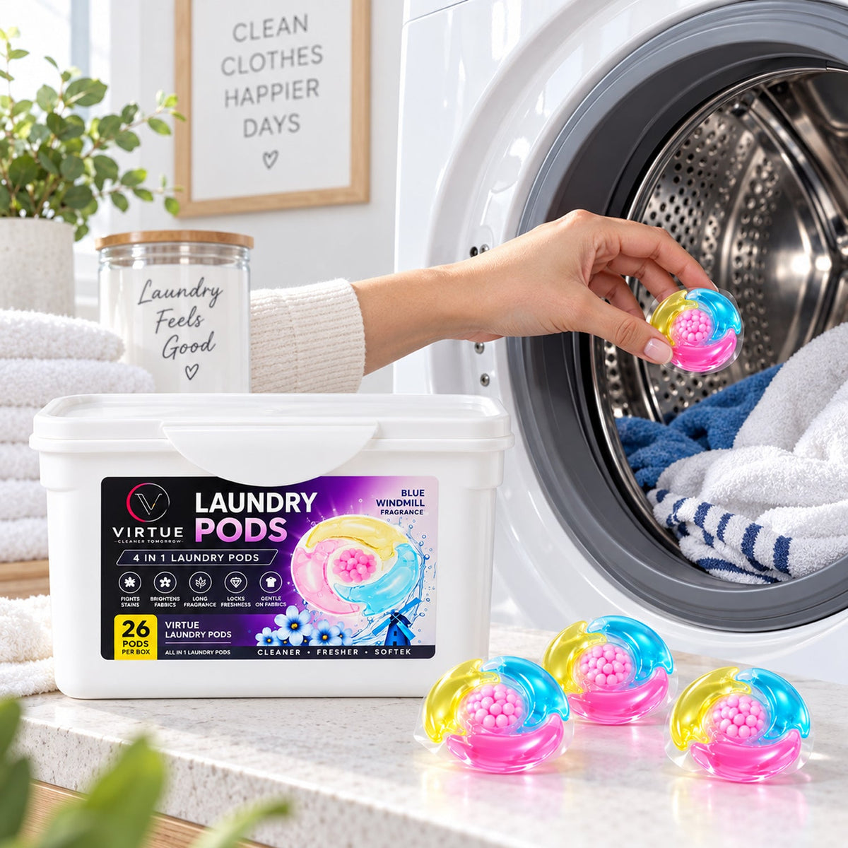A hand places a vibrant pink, blue, and yellow laundry pod into a washing machine drum filled with blue towels.
