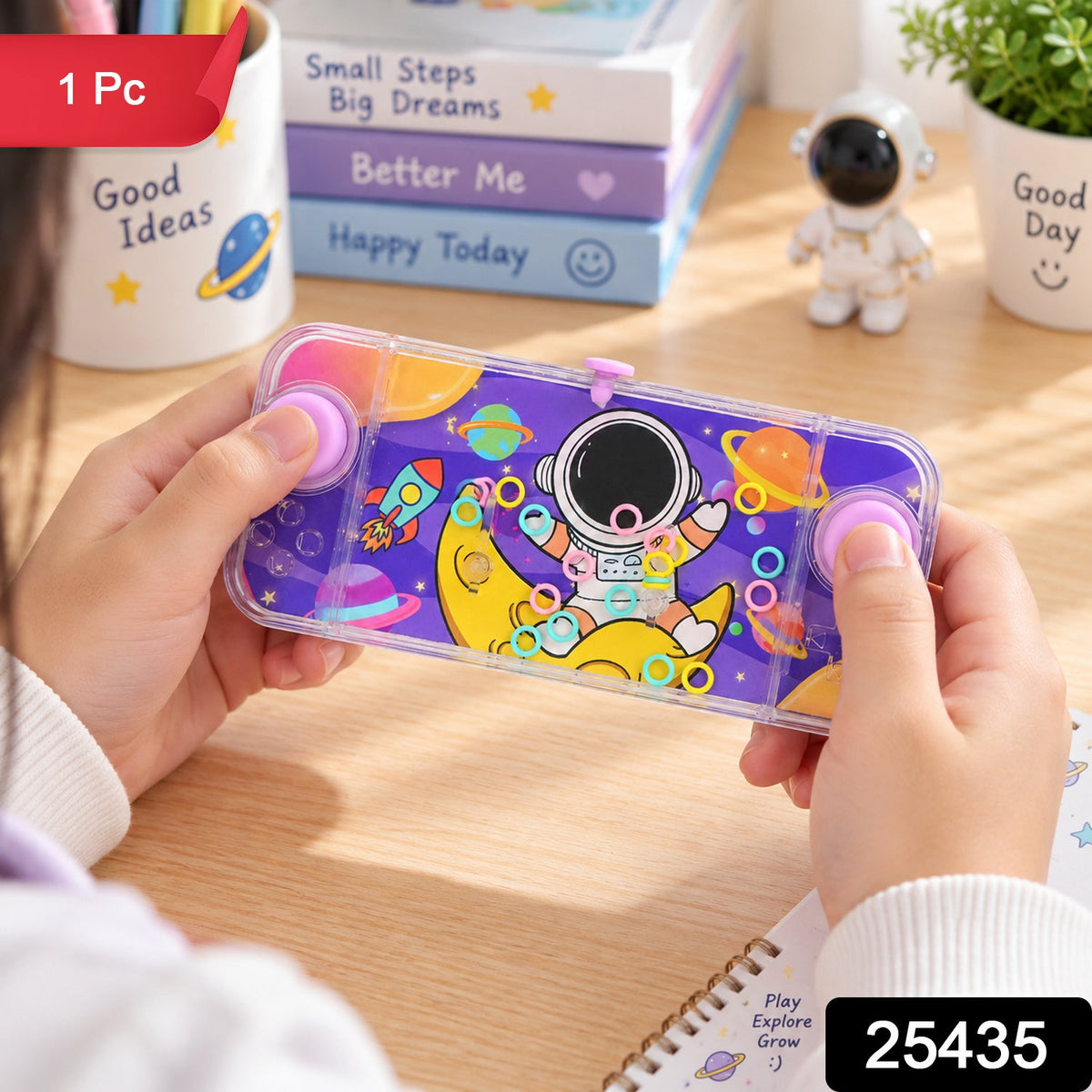 A child plays with the transparent purple water game, showing the astronaut and space elements on the design.