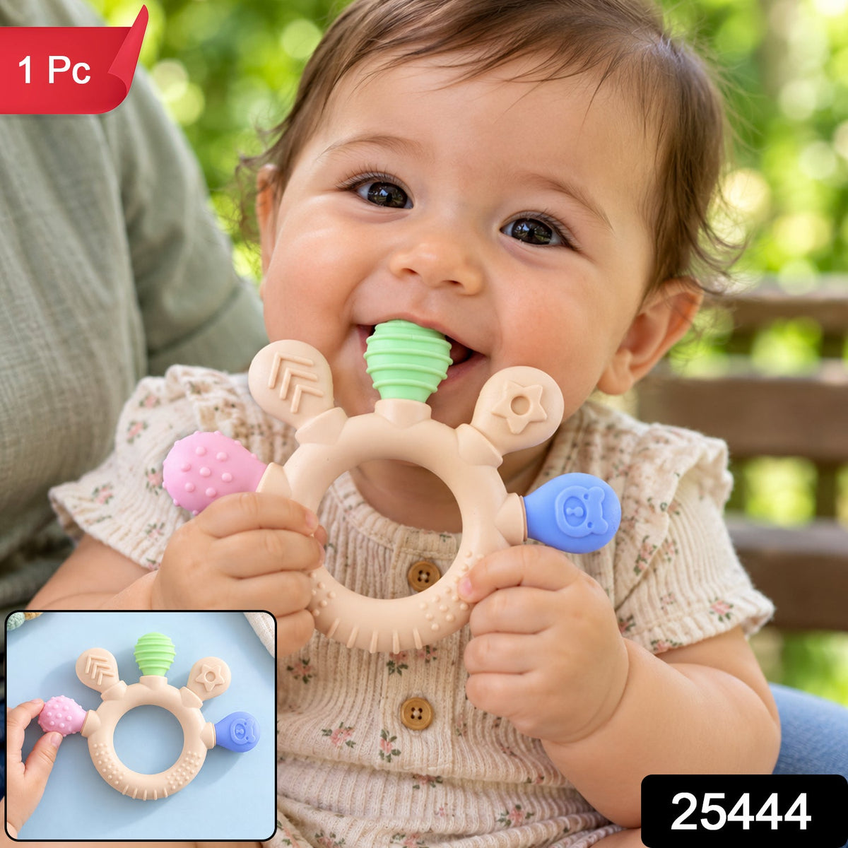 A smiling baby holds a beige teether with colorful textured ends, with a small inset image showing the product.