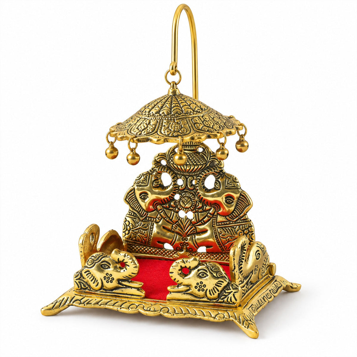 A gold-colored brass deity throne with an umbrella and elephant designs, featuring a red velvet seat on a white background.