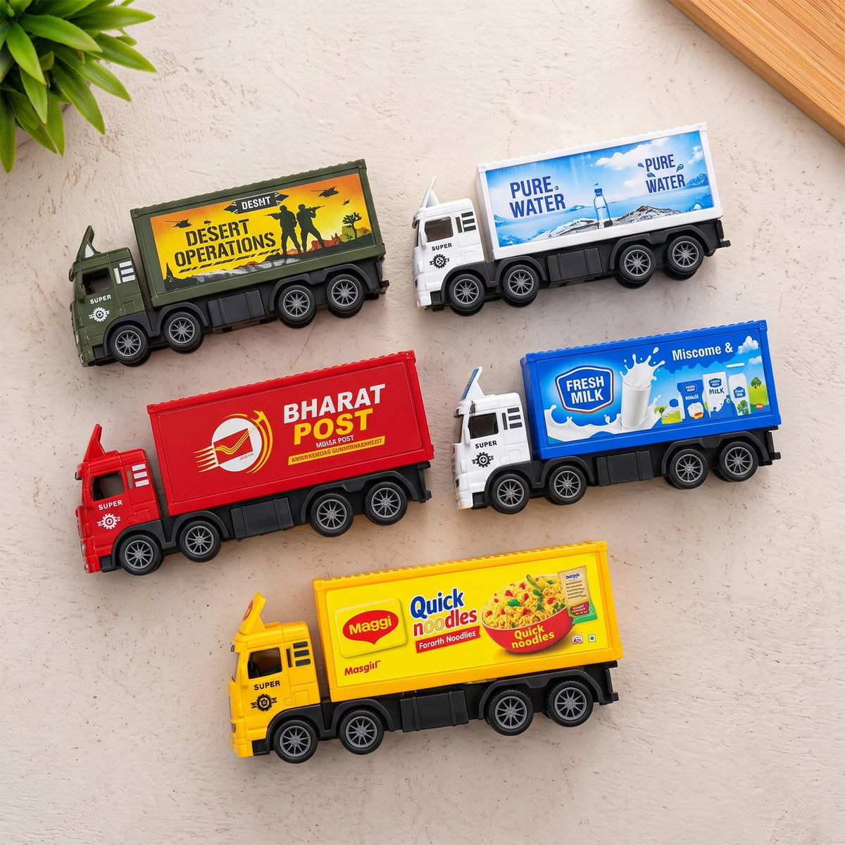 Five colorful toy trucks, each with a unique design, are neatly arranged on a light gray textured surface.