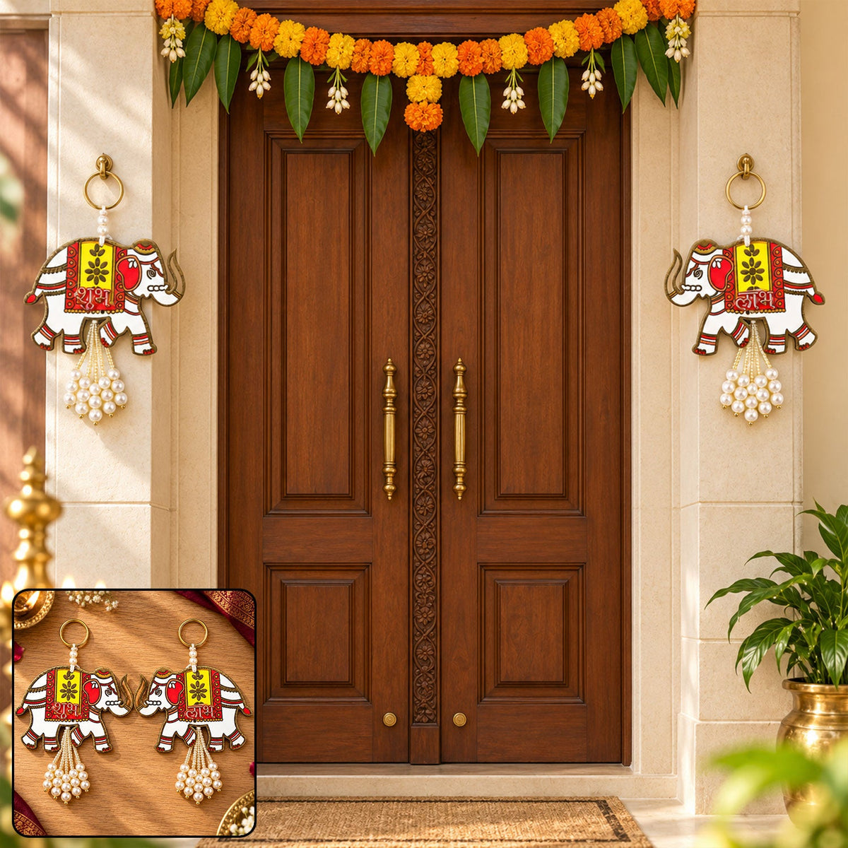 Two elephant hangings with pearl tassels adorn a wooden door, surrounded by festive marigold decorations.
