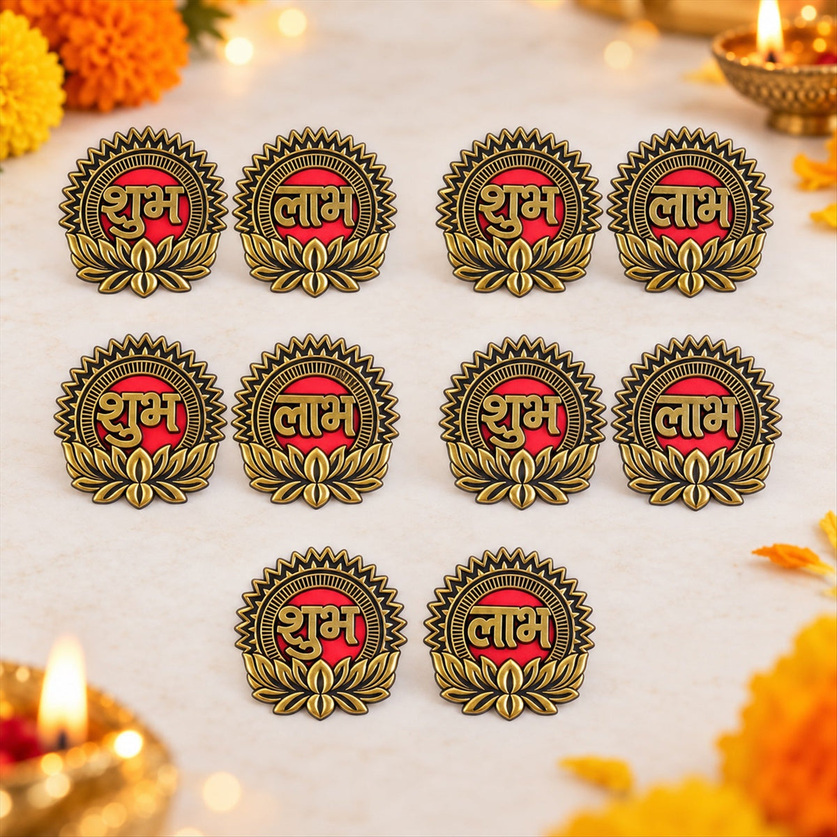 Ten gold and red Shubh Labh stickers with lotus designs arranged on a light surface, with blurred festive lights.