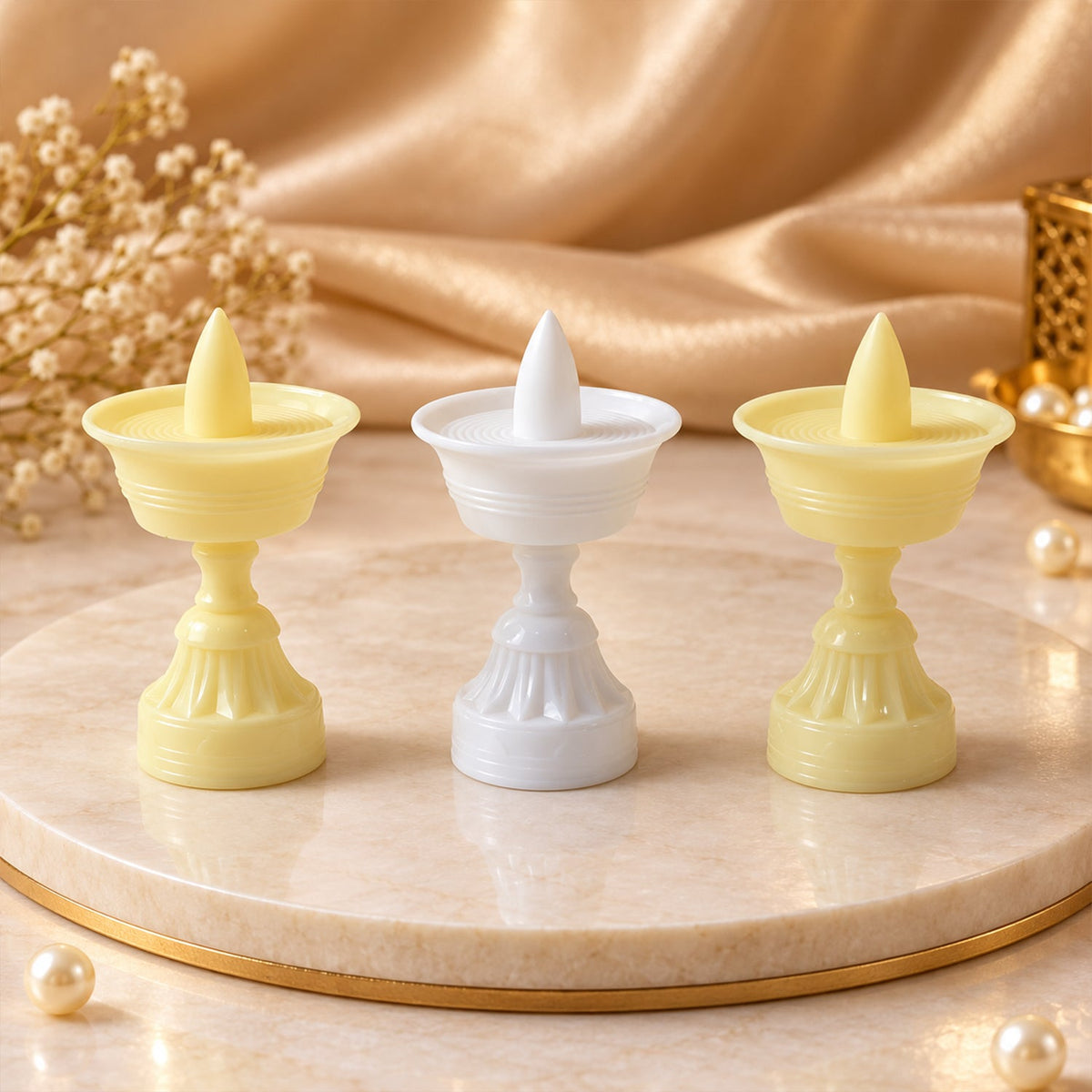 Flameless LED diya with its light off, highlighting the traditional design