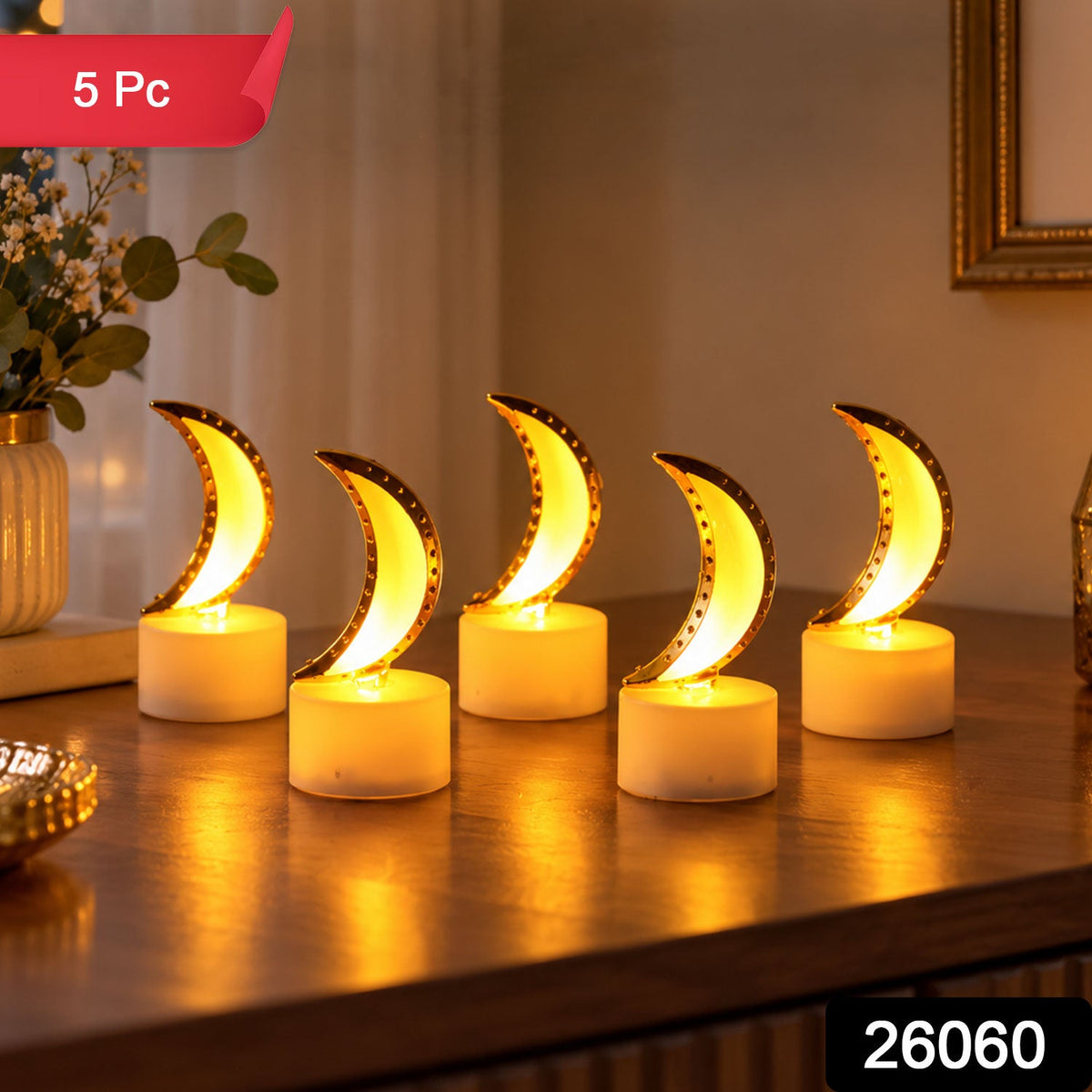 Five illuminated moon-shaped LED tealights with golden accents, casting a warm light on a wooden table, with text overlay