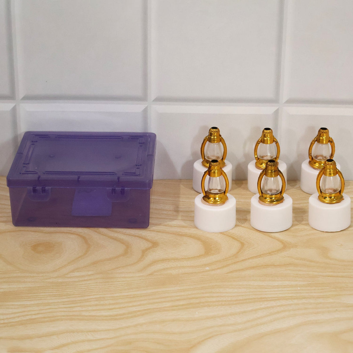 Six miniature LED lantern decorative lights in their clear plastic packaging