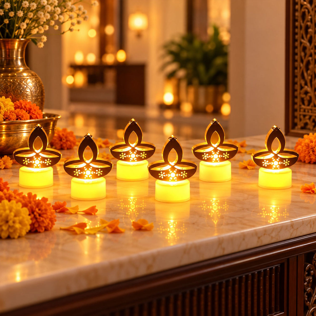 Golden diya LED tealight candles arranged on a surface