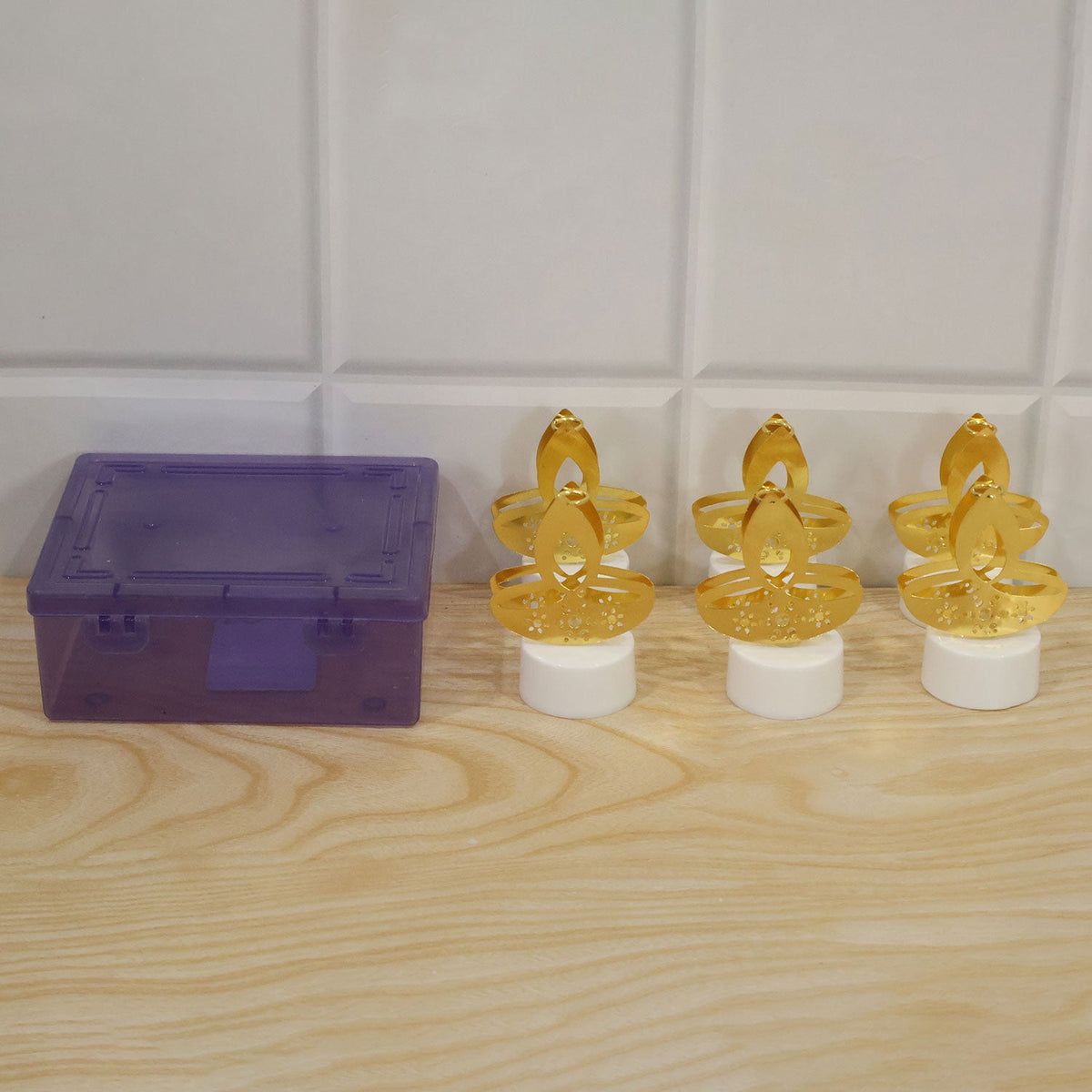 Actual golden diya LED tealight candle product and plastic box packaging
