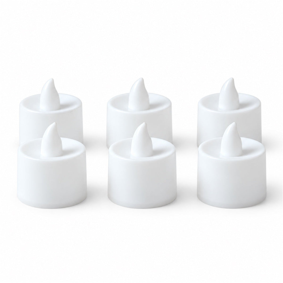 Six white flameless LED tealight candles, unlit, with a pointed top, neatly arranged on a plain white background.