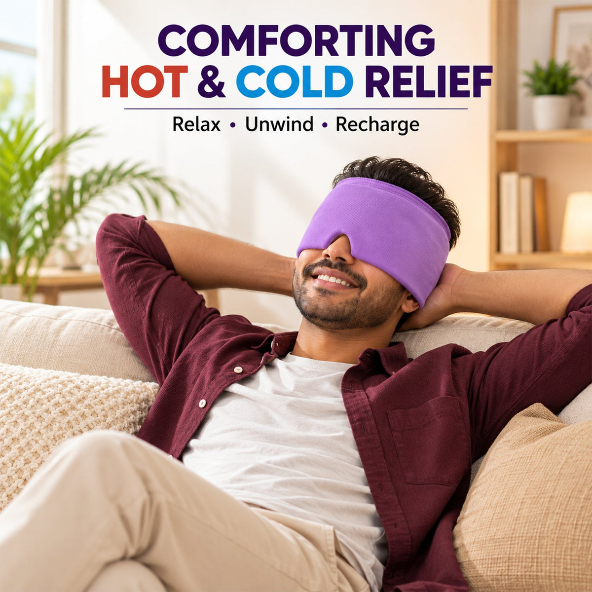 A man reclines on a couch, smiling with a purple head wrap covering his eyes and forehead.