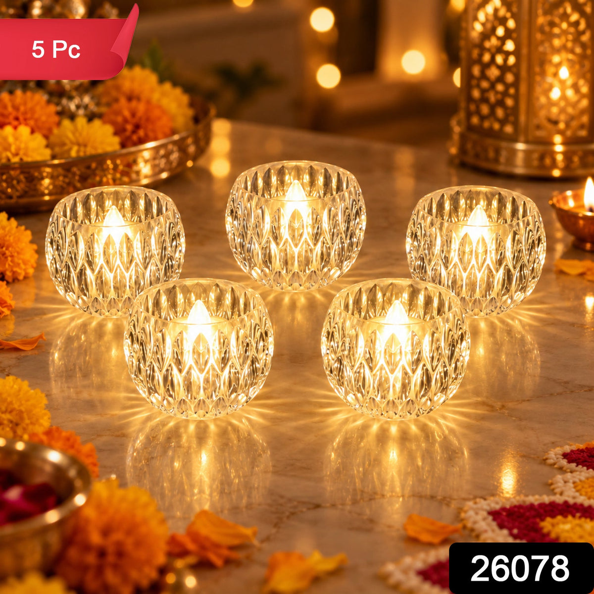 Five crystal LED tealights illuminate a festive tabletop with golden accents and floral elements.