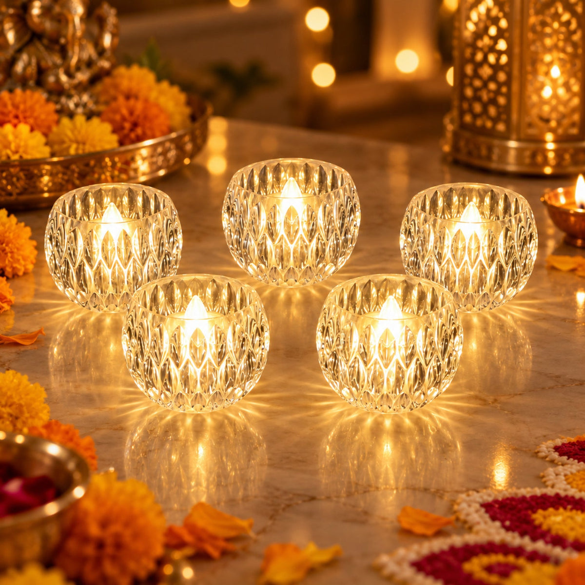 Five crystal LED tealights glow on a marble surface with festive decorations and warm lighting.