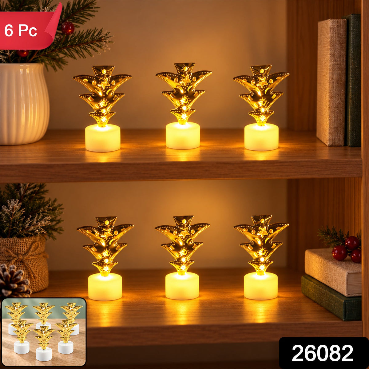 Six golden pineapple LED tealight candles glow on a wooden surface with a festive branch.