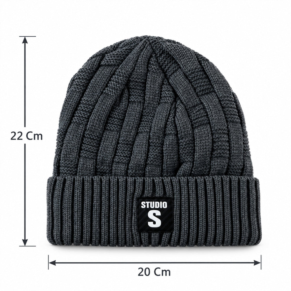 A dark grey cable knit beanie with a ribbed cuff and a black label, displaying its dimensions of 22 cm height and 20 cm