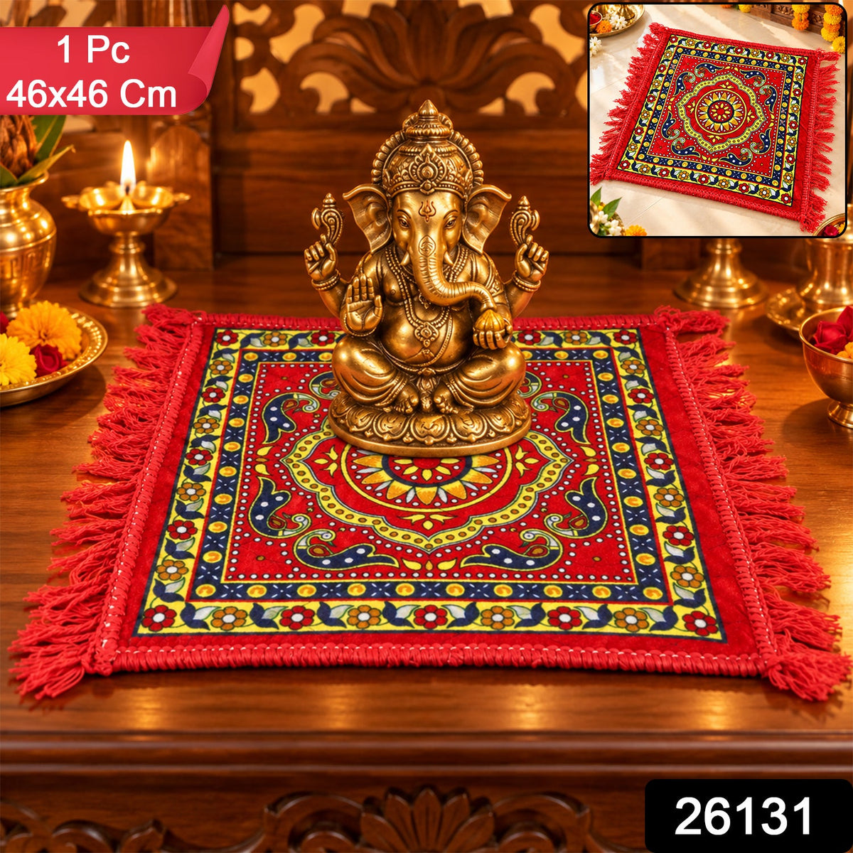 A red prayer mat with a yellow and blue traditional pattern and fringe, with a golden Ganesha idol on top, and a small inset