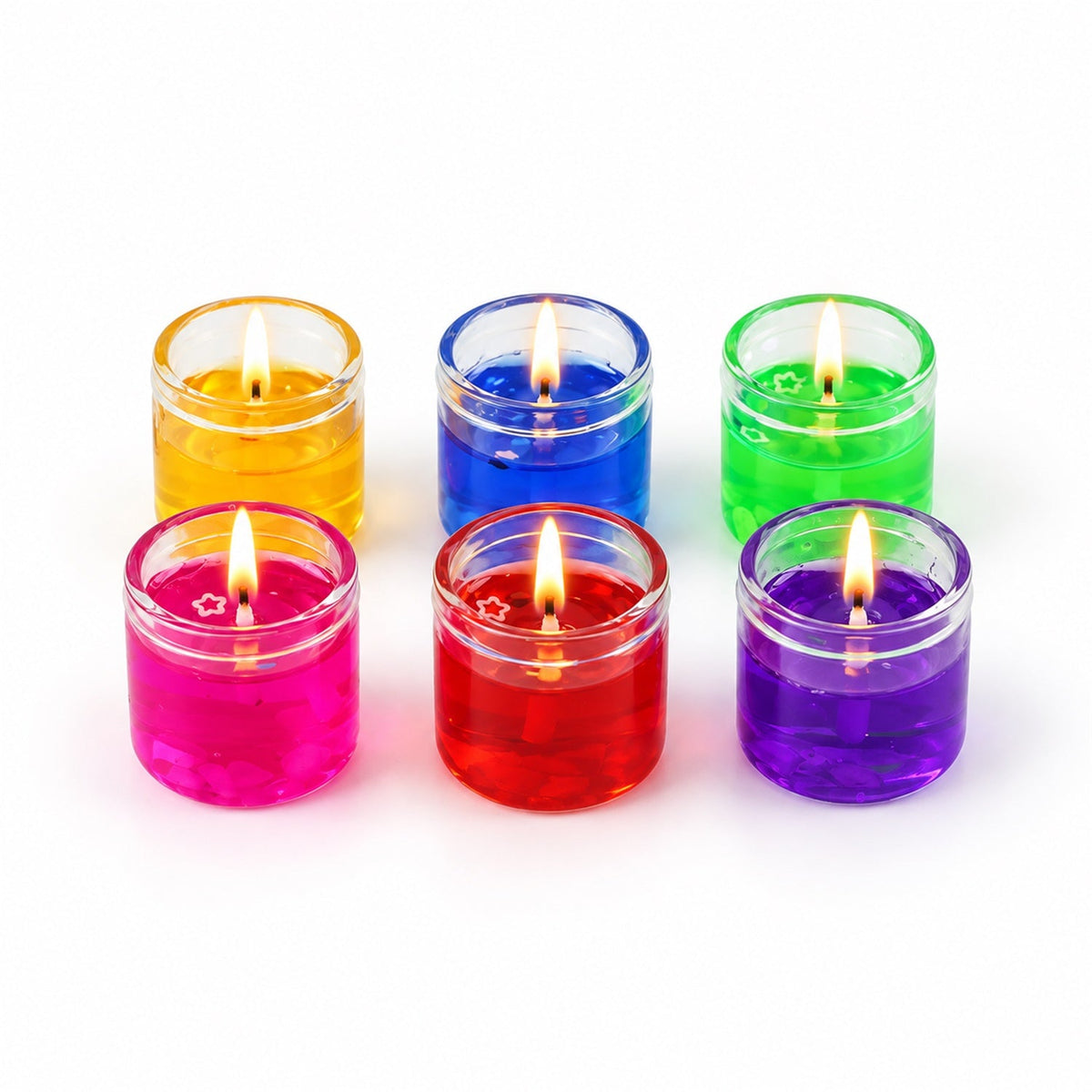 Six lit gel candles in glass jars, in yellow, blue, green, pink, red, and purple, arranged on a white background.