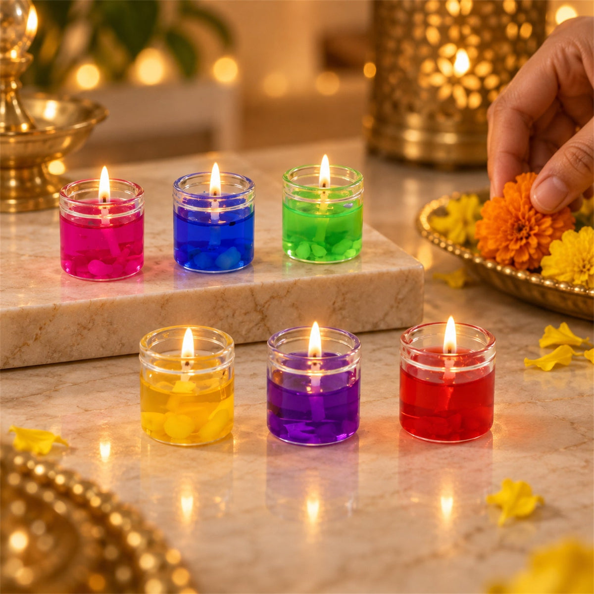 Six lit gel candles in glass jars, in yellow, blue, green, pink, red, and purple, arranged on a marble surface. â€“ view 8