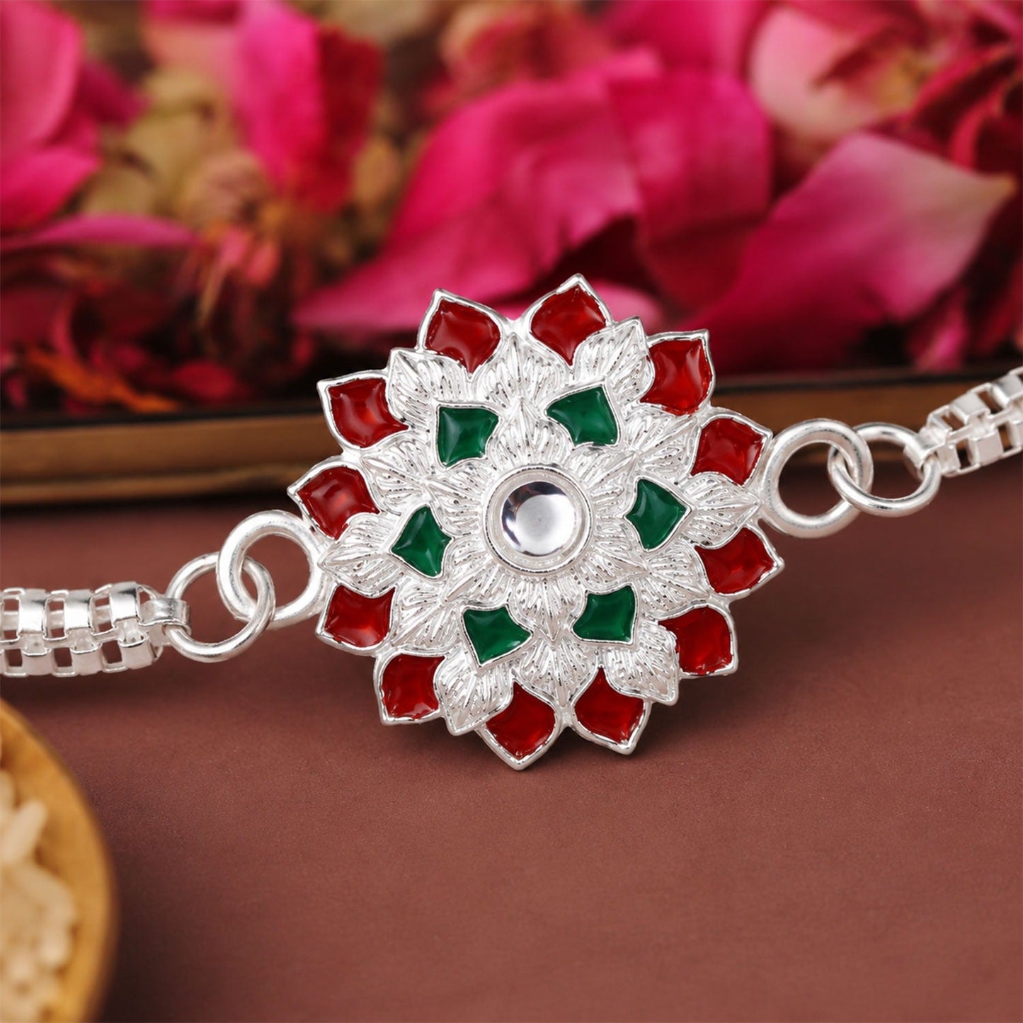 Elegant Silver Chain Rakhi for brother, featuring red and green accents.