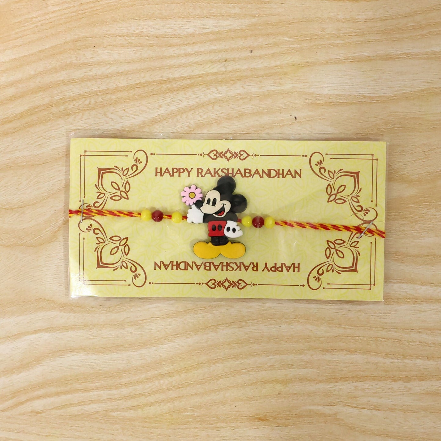 Close-up of the comfortable thread and adorable mouse design of this brother Rakhi.