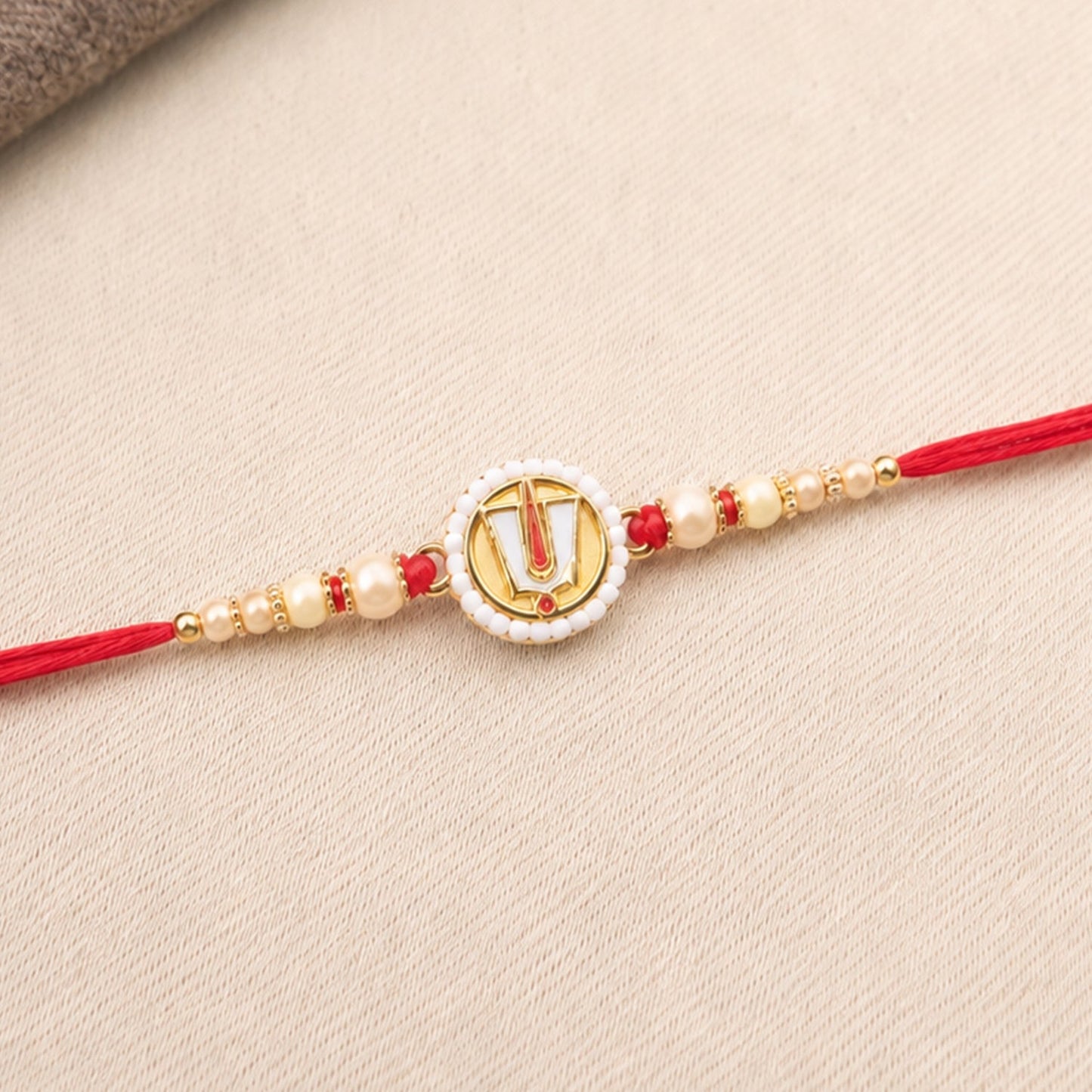 Decorative beads and traditional Tirupati Balaji motif on Rakhi