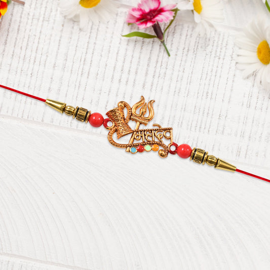 Close-up of Shiv Rakhi Trishul Damru Design handcrafted rakhi symbolizing sibling bond