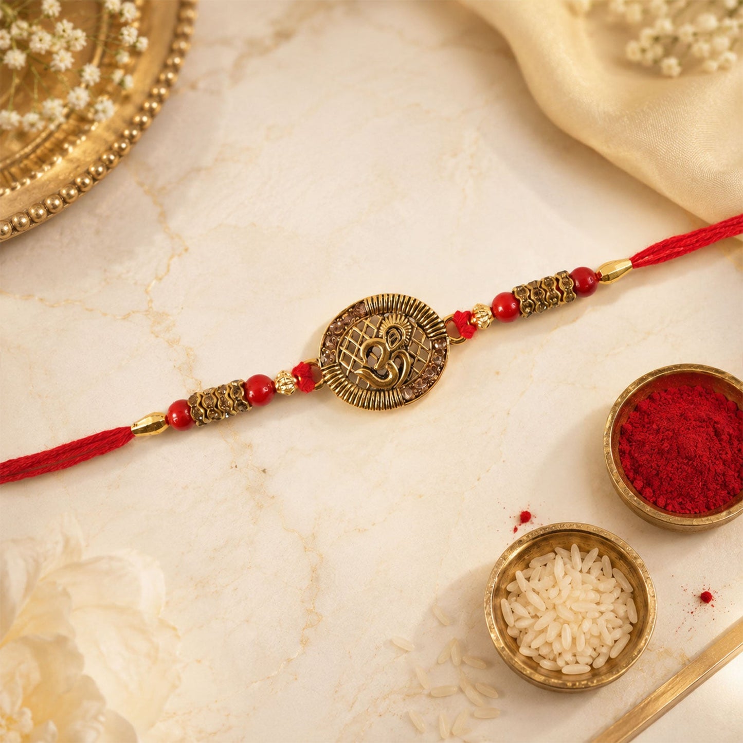 Close-up of Om Coin Rakhi highlighting intricate bead details and velvet finish