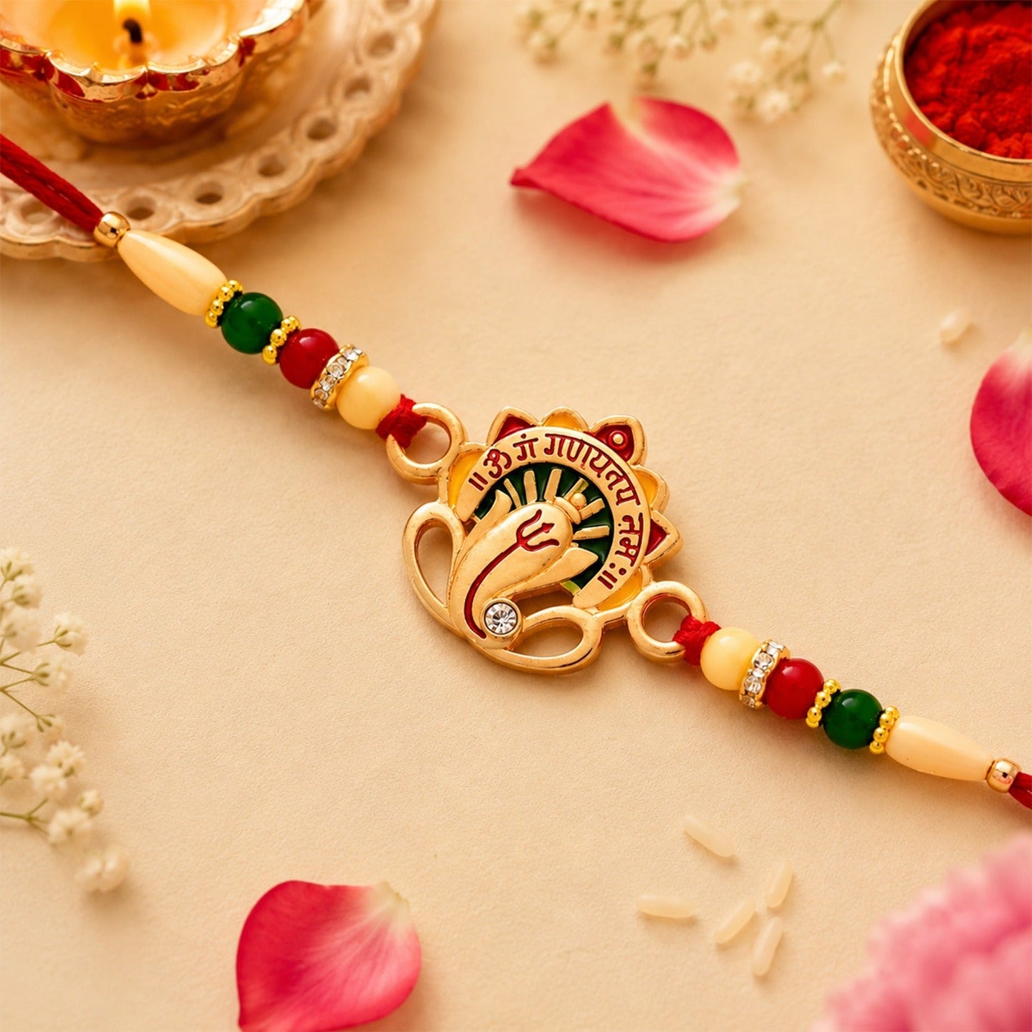 Om Ganesha Rakhi featuring intricate traditional beadwork and sacred design.